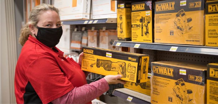 Staff member at displaying products